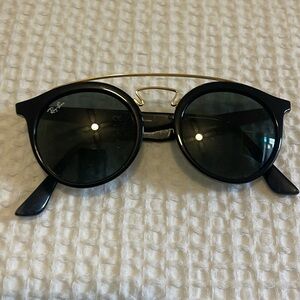 Ray-Bans round plastic frames gold trim green lenses